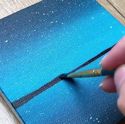 Someone working on a mini painting